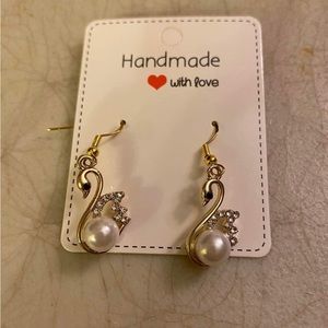 Gold swan earrings